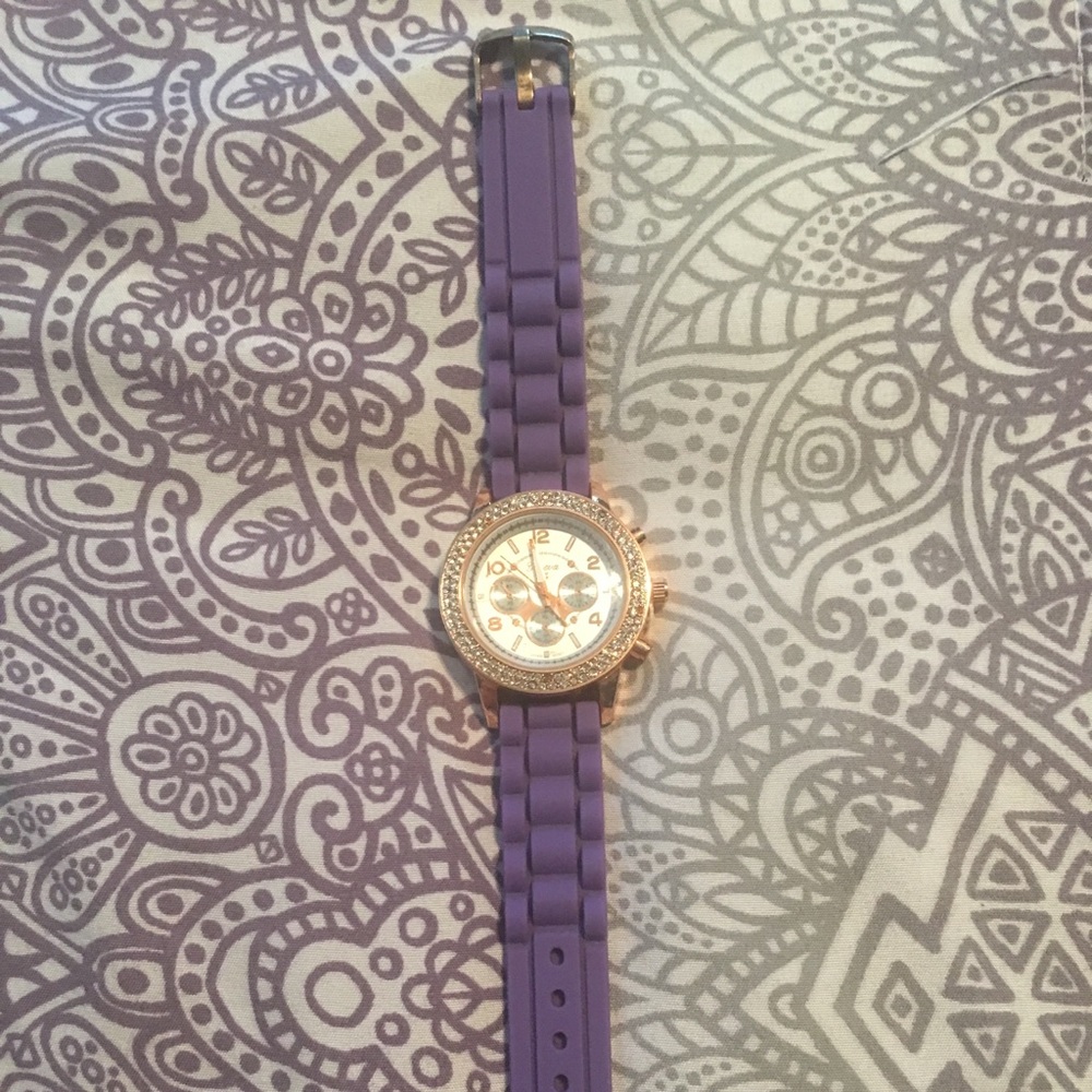 A purple and rhinestoned watch